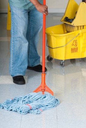 Clean America Commercial Office Cleaning janitor in El Dorado Hills, CA mopping floor.